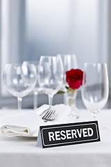 Image showing Romantic dinner setting with reserved sign