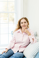 Image showing Woman relaxing by the window