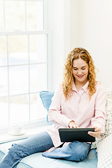 Image showing Woman with tablet computer at home