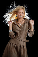 Image showing dancing blond in brown dress