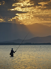 Image showing Fisherman at sunrise 