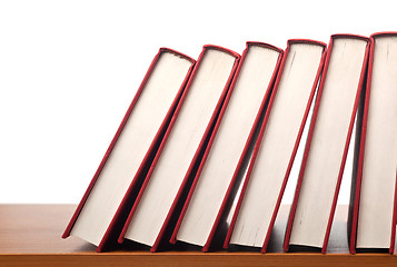 Image showing Row of books falling in sequence