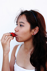 Image showing Eating a strawberry