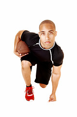 Image showing Football player kneeling.
