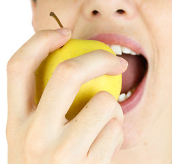 Image showing Girl taking a bite of an apple.
