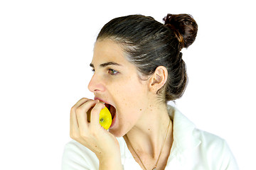 Image showing Girl taking a bite of an apple.