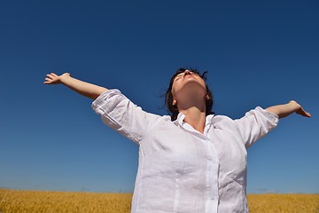 Image showing young woman in wheat field at summer