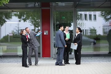 Image showing Diverse businesspeople chatting outdoors