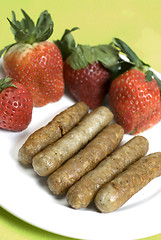 Image showing pork sausage links with strawberries