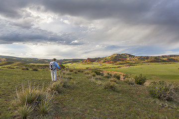 Image showing hiker and Red Mountain