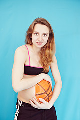 Image showing Pregnant girl with a picture