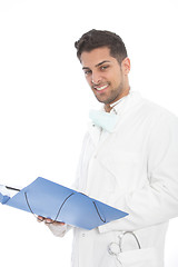 Image showing Confident young male doctor with a file