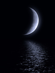 Image showing Half of moon in the dark blue sky