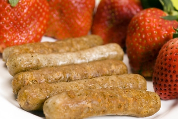 Image showing pork sausage links with strawberries