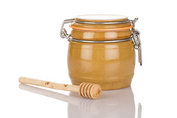 Image showing Honey pot and stick