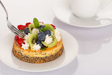 Image showing Cheese-cake, strawberries, blueberries and kiwi
