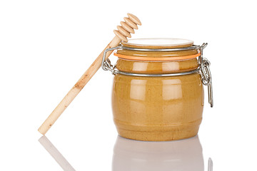 Image showing Honey pot and stick
