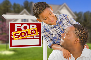 Image showing Mixed Race Father and Son In Front of Real Estate Sign and House