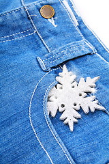Image showing Snowflake in a pocket of blue jeans.