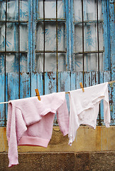Image showing Sweater and t-shirt hanging on a clothes line