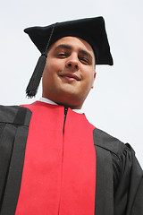 Image showing Attractive man in gowns on university graduation day