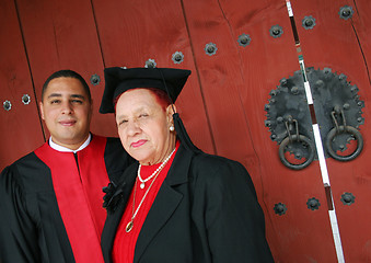 Image showing University graduate in robes with his grandmother