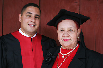 Image showing University graduate in robes with his grandmother.