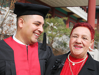 Image showing Happy graduate shares a moment with his grandmother