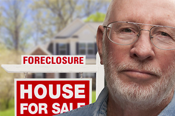 Image showing Depressed Senior Man in Front of Foreclosure Sign and House