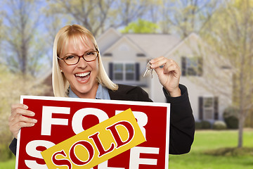 Image showing Woman with Sold Sign and Keys in Front of House