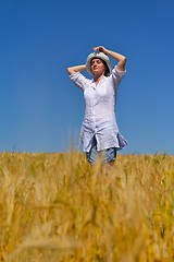 Image showing young woman in wheat field at summer