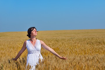 Image showing young woman in wheat field at summer