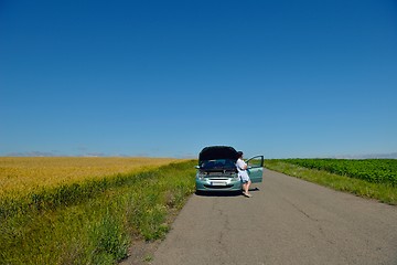 Image showing woman with broken car