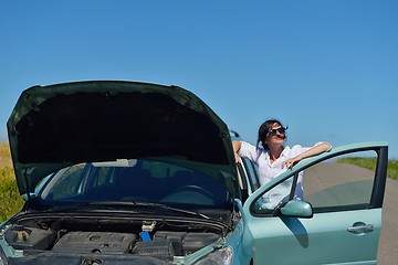 Image showing woman with broken car
