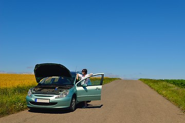 Image showing woman with broken car