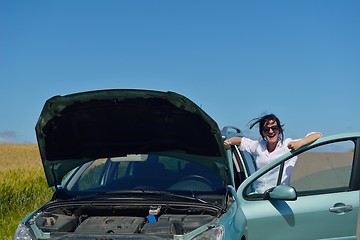 Image showing woman with broken car