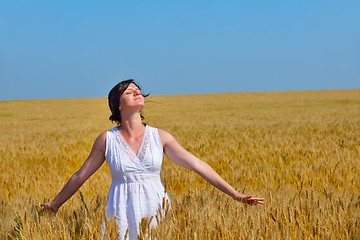 Image showing young woman in wheat field at summer