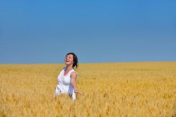 Image showing young woman in wheat field at summer