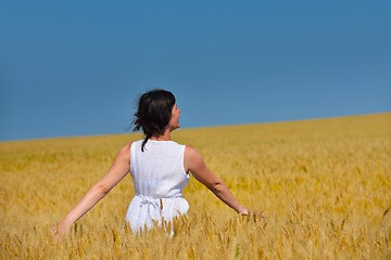 Image showing young woman in wheat field at summer