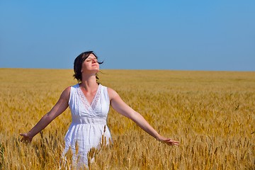 Image showing young woman in wheat field at summer