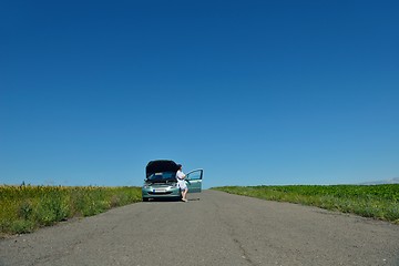 Image showing woman with broken car