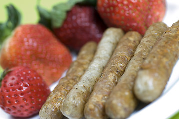 Image showing pork sausage links with strawberries