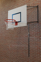 Image showing Basketball hoop on an oldbrick wall