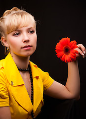 Image showing beautiful female holding red flower