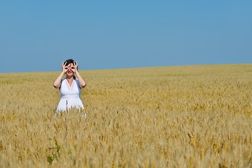 Image showing young woman in wheat field at summer