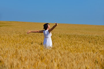 Image showing young woman in wheat field at summer