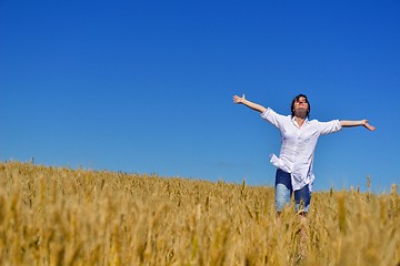 Image showing young woman in wheat field at summer