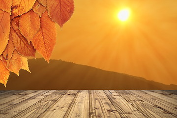 Image showing autumn backdrop with wooden terrace