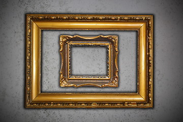 Image showing two ancient empty frames on grungy wall