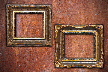 Image showing two vintage frames on rusty metal wall